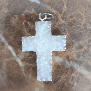Very light pink ivory textured cross.